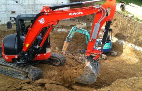 Vargo digging pool demolition with tufo